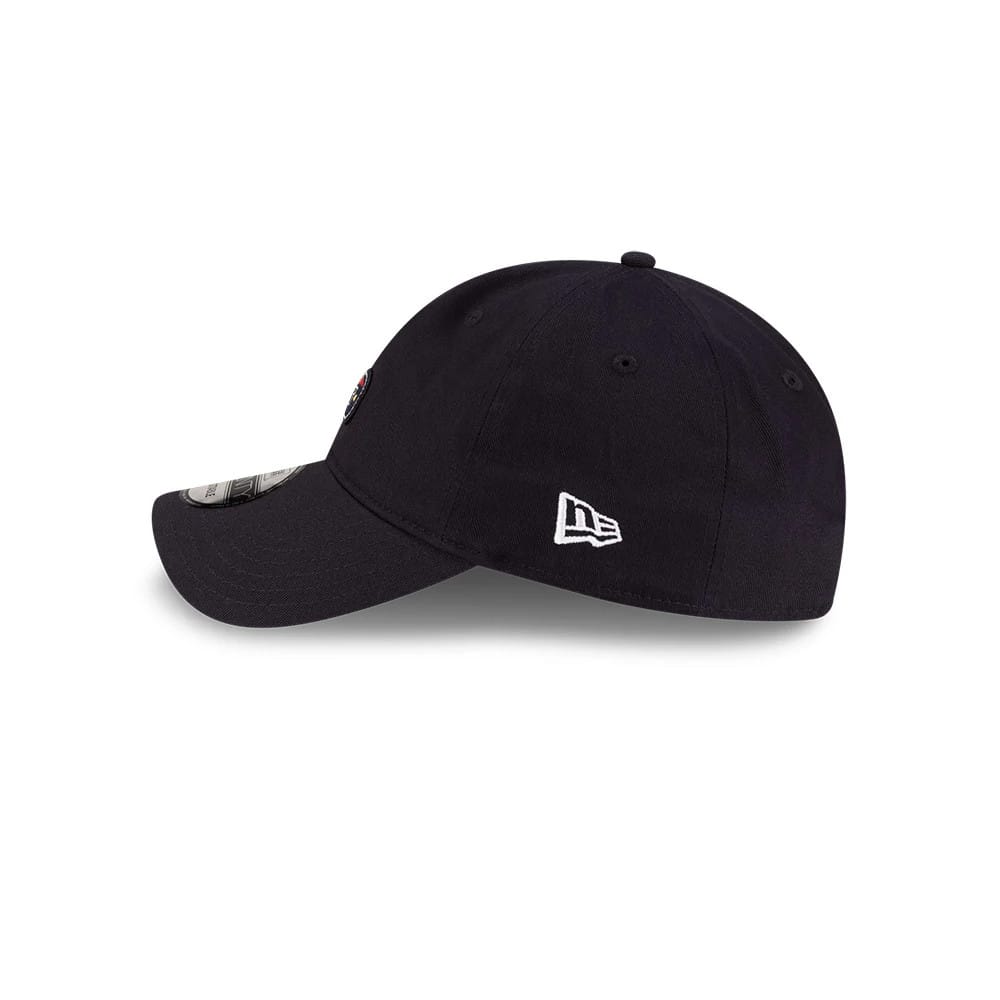 Lacoste X New Era Navy 9TWENTY Adjustable Cap, side view showing the white embroidered New Era flag logo on the left side, a structured navy crown with matching eyelets, and a 9TWENTY size sticker on the curved visor.