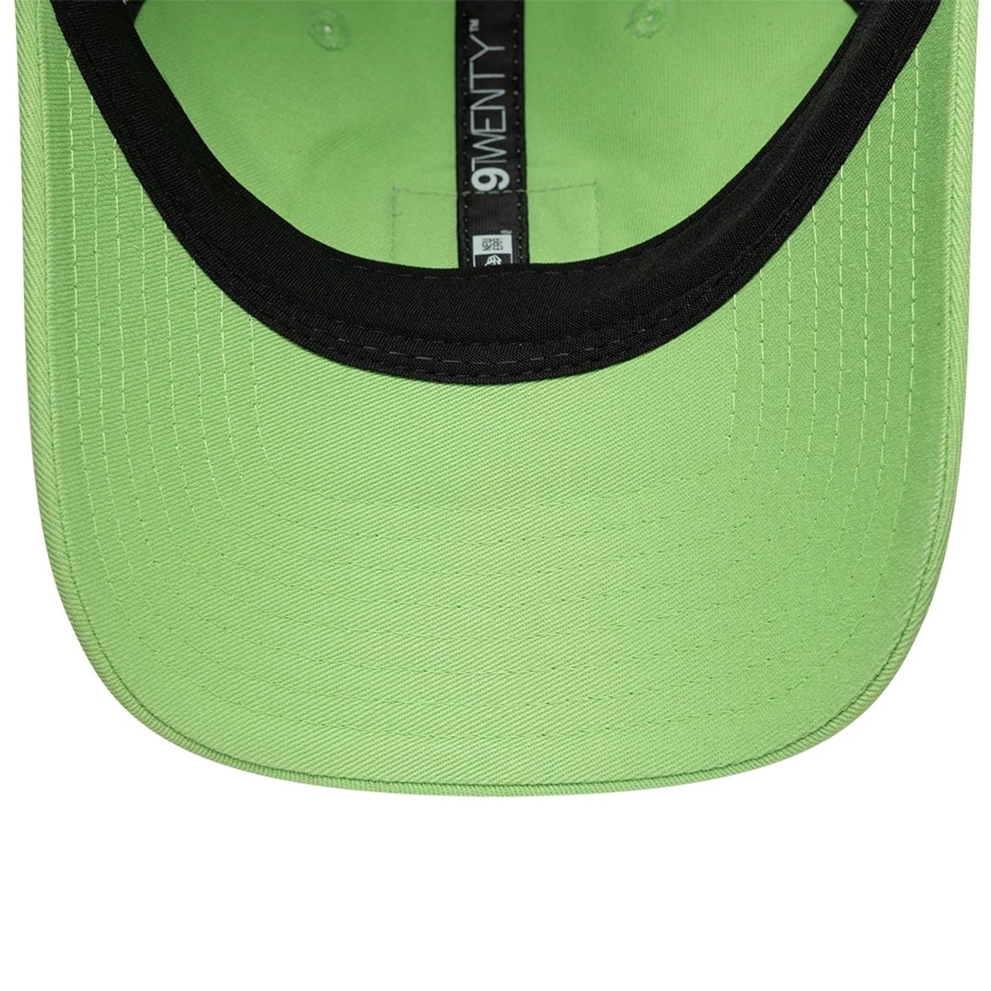 Lacoste X New Era Pastel Green 9TWENTY Adjustable Cap, inside view showing a black sweatband, pastel green undervisor, and black 9TWENTY taping along the inner lining, highlighting the structured interior design of the adjustable cap.