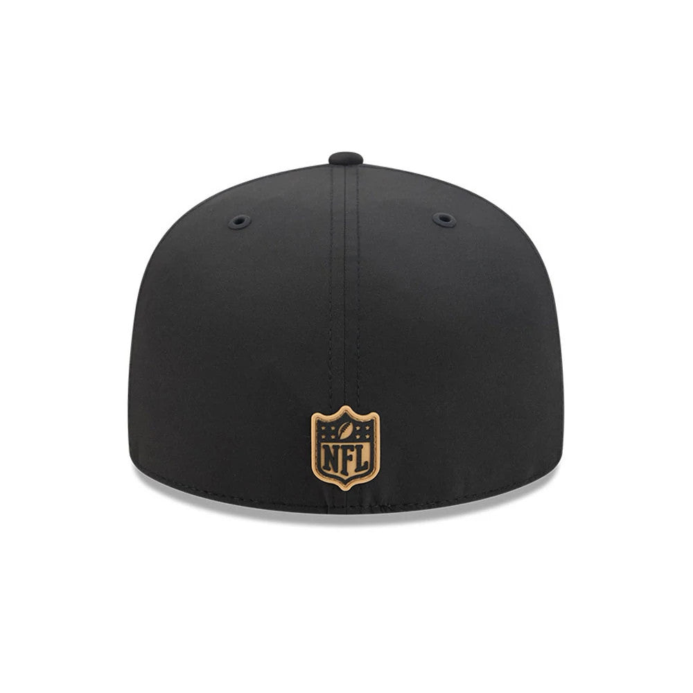 New Orleans Saints NFL Sideline 2026 Black New Era 59FIFTY Fitted Cap, rear view showing an embroidered gold NFL shield logo at the centre back, accented with black crown eyelets and a matching top button on the structured black crown.