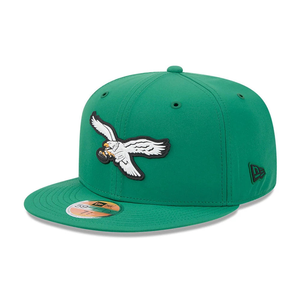 Philadelphia Eagles NFL Sideline 2026 Green New Era 59FIFTY Fitted Cap, three-quarter view showing the white and grey eagle logo in raised embroidery on the green front panels, matching flat visor with a gold 59FIFTY size sticker.