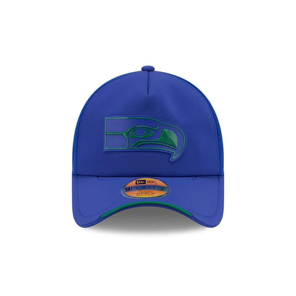Seattle Seahawks NFL Sideline 2026 Blue New Era 9FORTY Apex Adjustable Cap, front view showing the raised blue and green Seahawks logo embroidered on the front panel, with a curved blue visor, green undervisor, and 9FORTY size sticker on the visor.