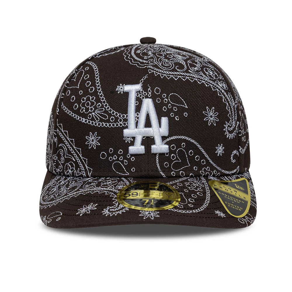 LA Dodgers MLB All Over Paisley Dark Brown New Era 59FIFTY Fitted Cap, front view showing the white embroidered LA logo on the paisley-patterned crown, complemented by the gold 59FIFTY size sticker and flat visor.