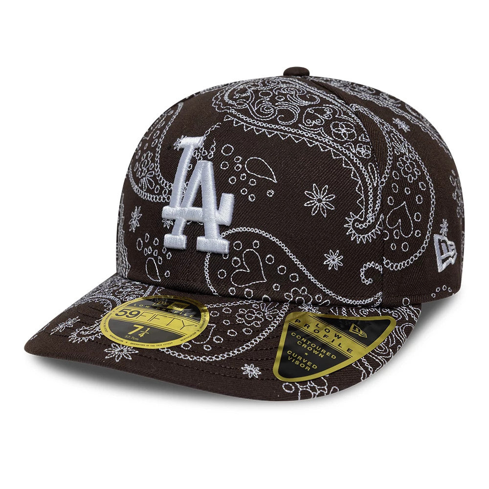 LA Dodgers MLB All Over Paisley Dark Brown New Era Low Profile 59FIFTY Fitted Cap, front view showing a prominent white embroidered LA logo on the structured brown crown with intricate paisley patterns.