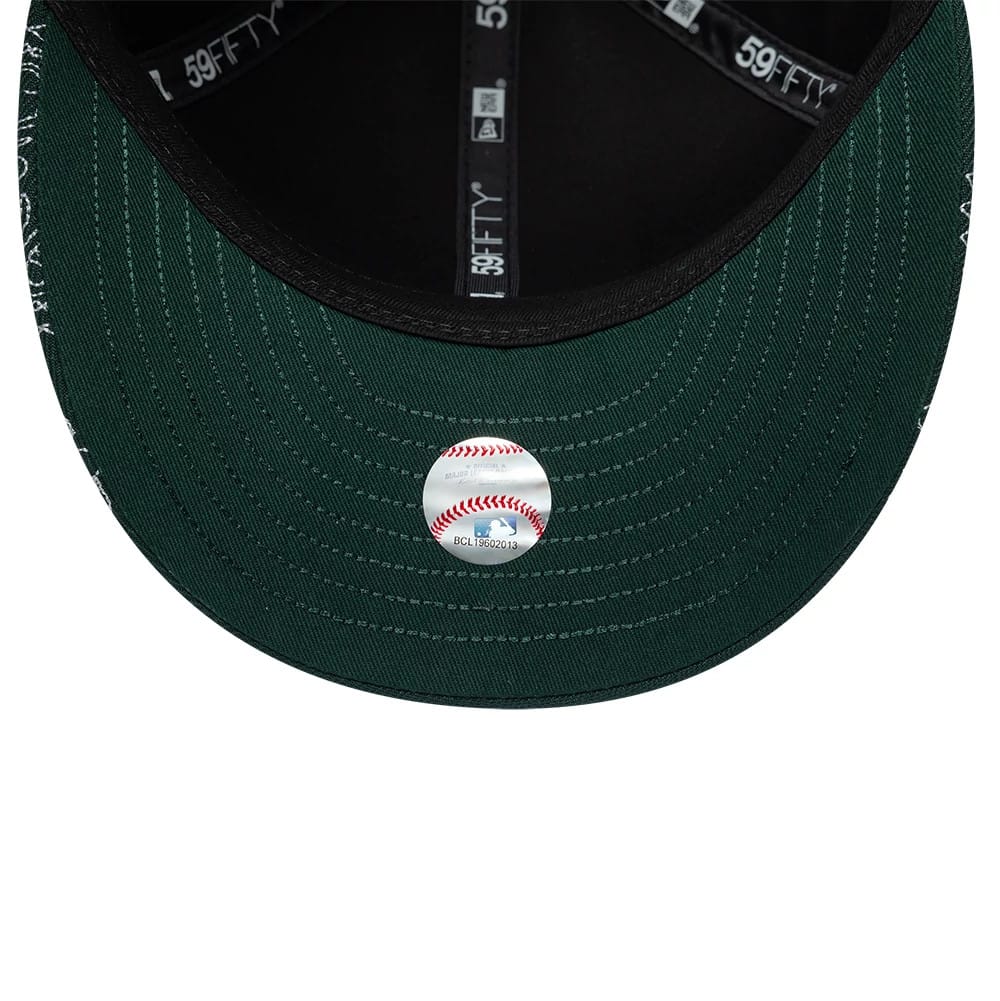 Pictured is this MLB All Over Paisley Athletics Low Profile 59FIFTY Fitted cap in dark green. 7