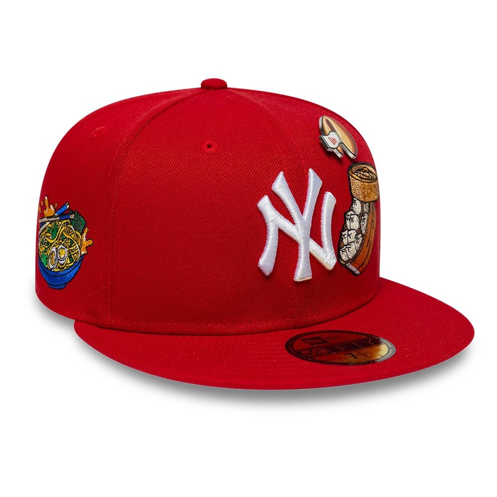 New York Yankees MLB Food Red New Era 59FIFTY Fitted Cap, three-quarter view showing the raised white NY logo on the red crown, with food-themed embroidered graphics on the front panel and side.