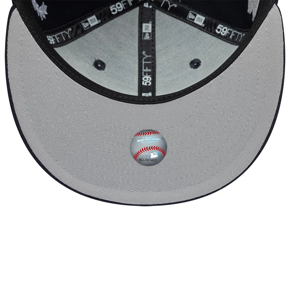 New York Yankees MLB Mythical Navy New Era 59FIFTY Fitted Cap, inside view showing the grey undervisor with an MLB baseball sticker, black taping with 59FIFTY branding, and black sweatband lining the cap's interior.