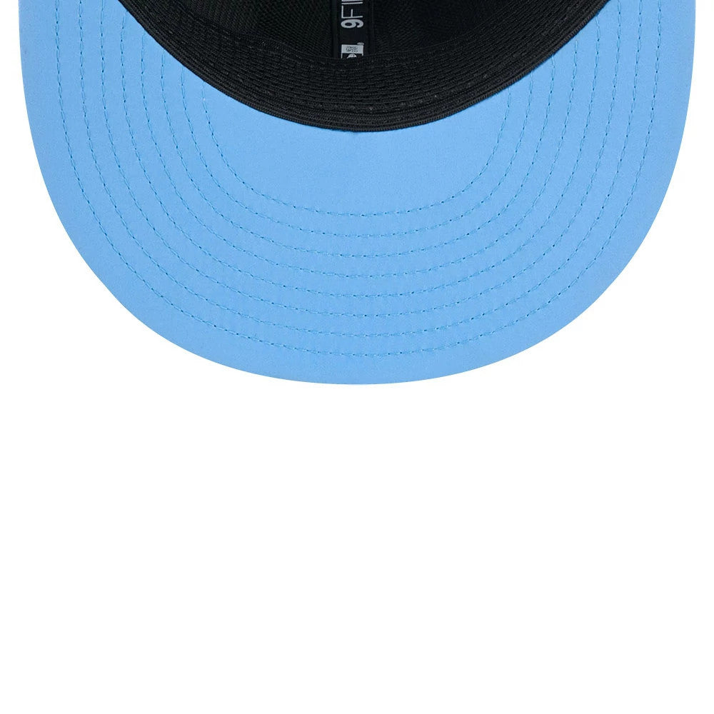 Titans NFL Sideline 2026 Charcoal New Era 9FIFTY Snapback Adjustable Cap, inside view showing a bright blue under visor with black stitching, black inner sweatband and taping with branding, and a glimpse of the adjustable snapback closure.