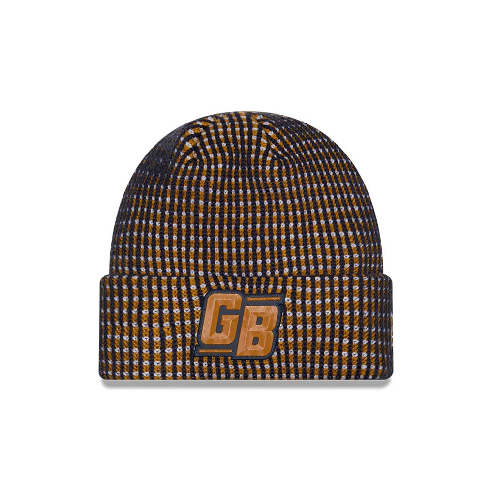 New Era Green Bay Packers NFL Sideline 2026 Dark Blue Cuff Knit Beanie Hat, front view showing the contrasting yellow and blue check pattern, with a prominent GB logo embroidered on the cuff in gold and black thread.