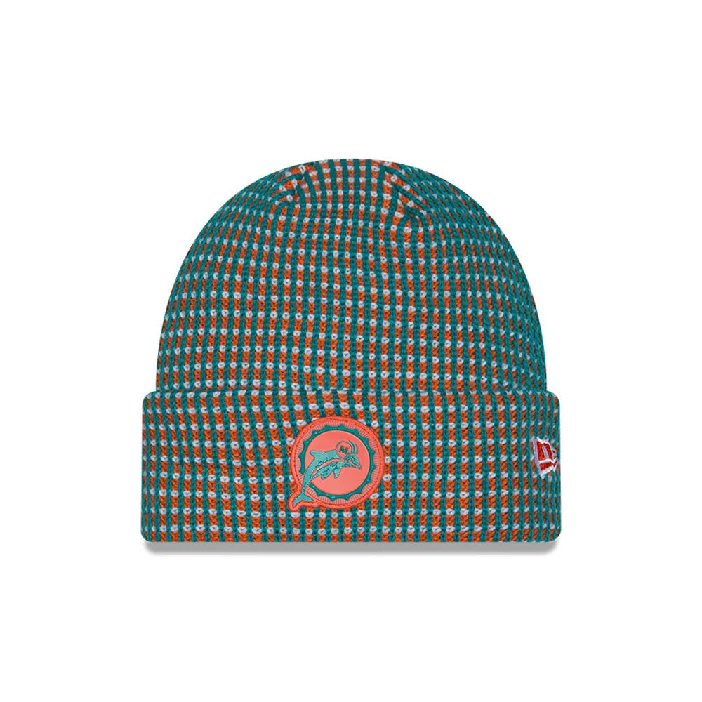 New Era Miami Dolphins NFL Sideline 2026 Orange Cuff Knit Beanie Hat, front view showing the embroidered Miami Dolphins logo on the cuff in aqua and orange, a textured check pattern in teal and orange across the beanie.