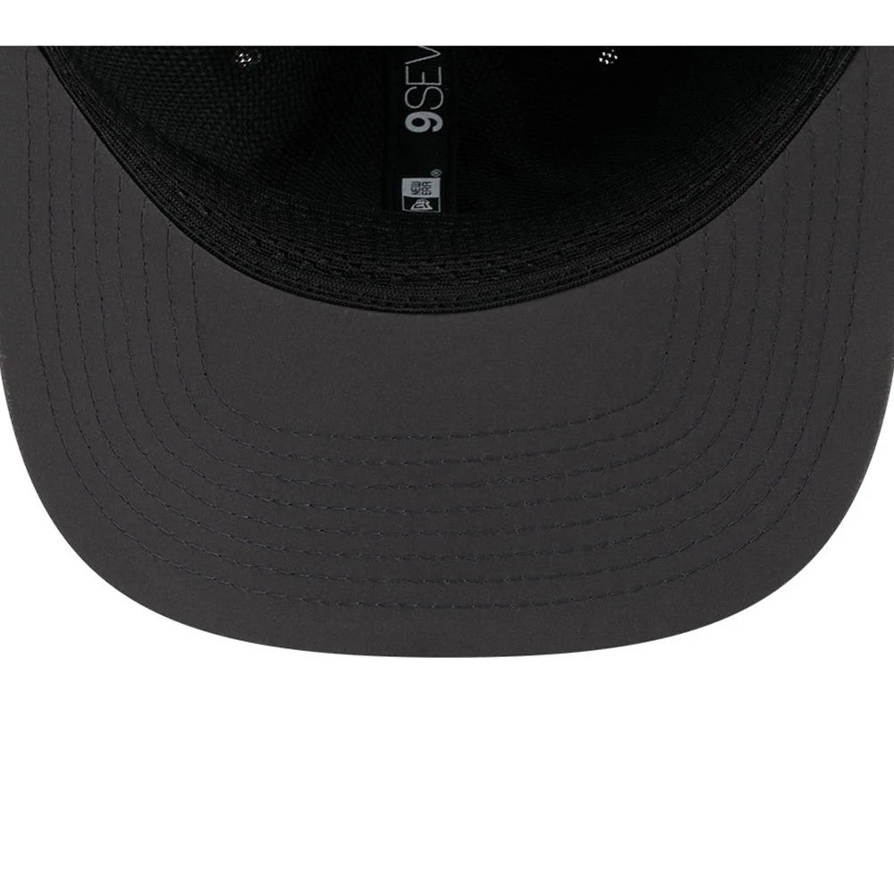 Seahawks NFL Sideline 2026 Charcoal New Era 9SEVENTY Stretch Snap Adjustable Cap, inside view showing a black sweatband, a dark grey undervisor, and the black internal taping with 9SEVENTY lettering in white.
