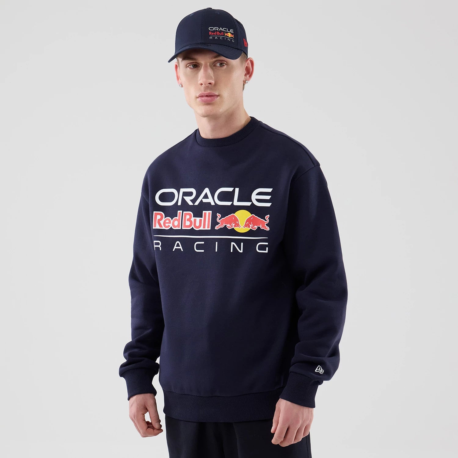 The model is wearing this Red Bull Racing Oversized Crew Neck Sweater in dark blue. 1