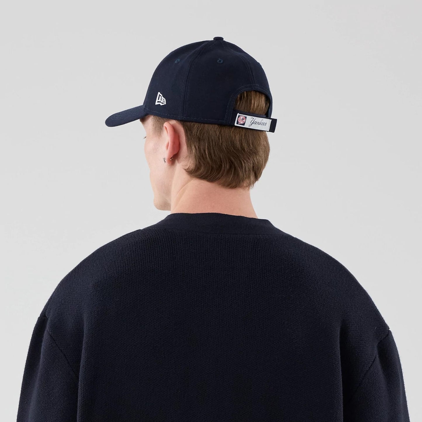 The model is wearing this MLB Knit New York Yankees Cardigan in navy. 7