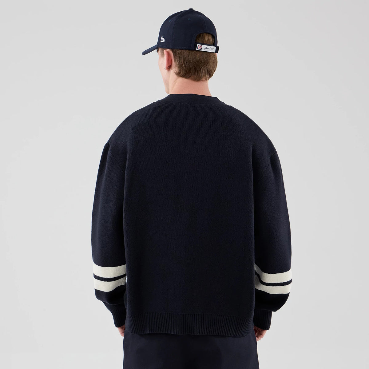The model is wearing this MLB Knit New York Yankees Cardigan in navy. 2