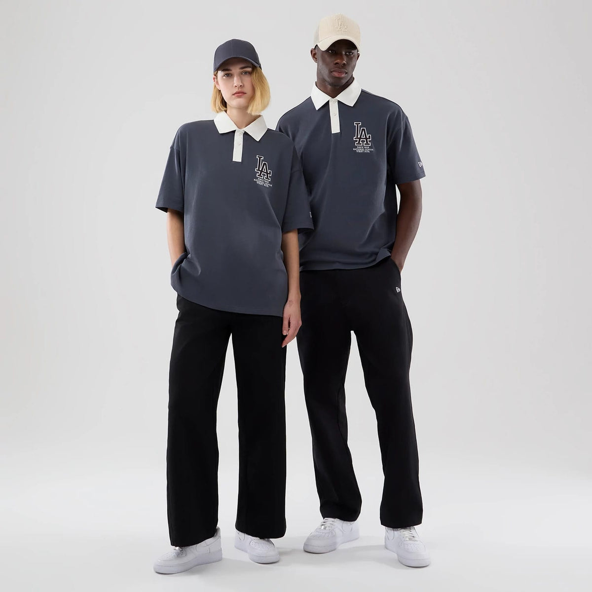 The model is wearing this MLB LA Dodgers Polo T-Shirt in grey. 1