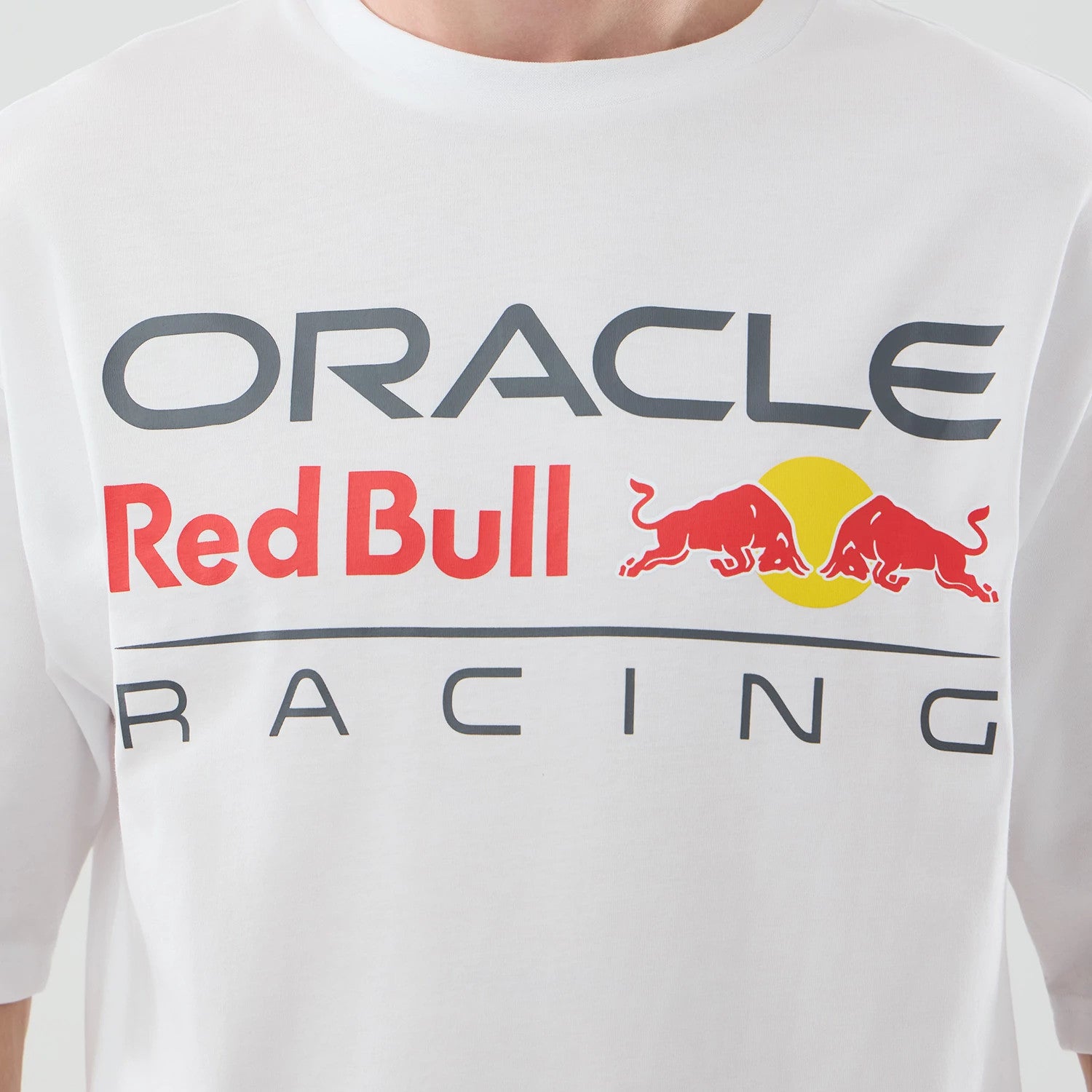 The model is wearing this Red Bull Racing Graphic Oversized T-Shirt in white. 4