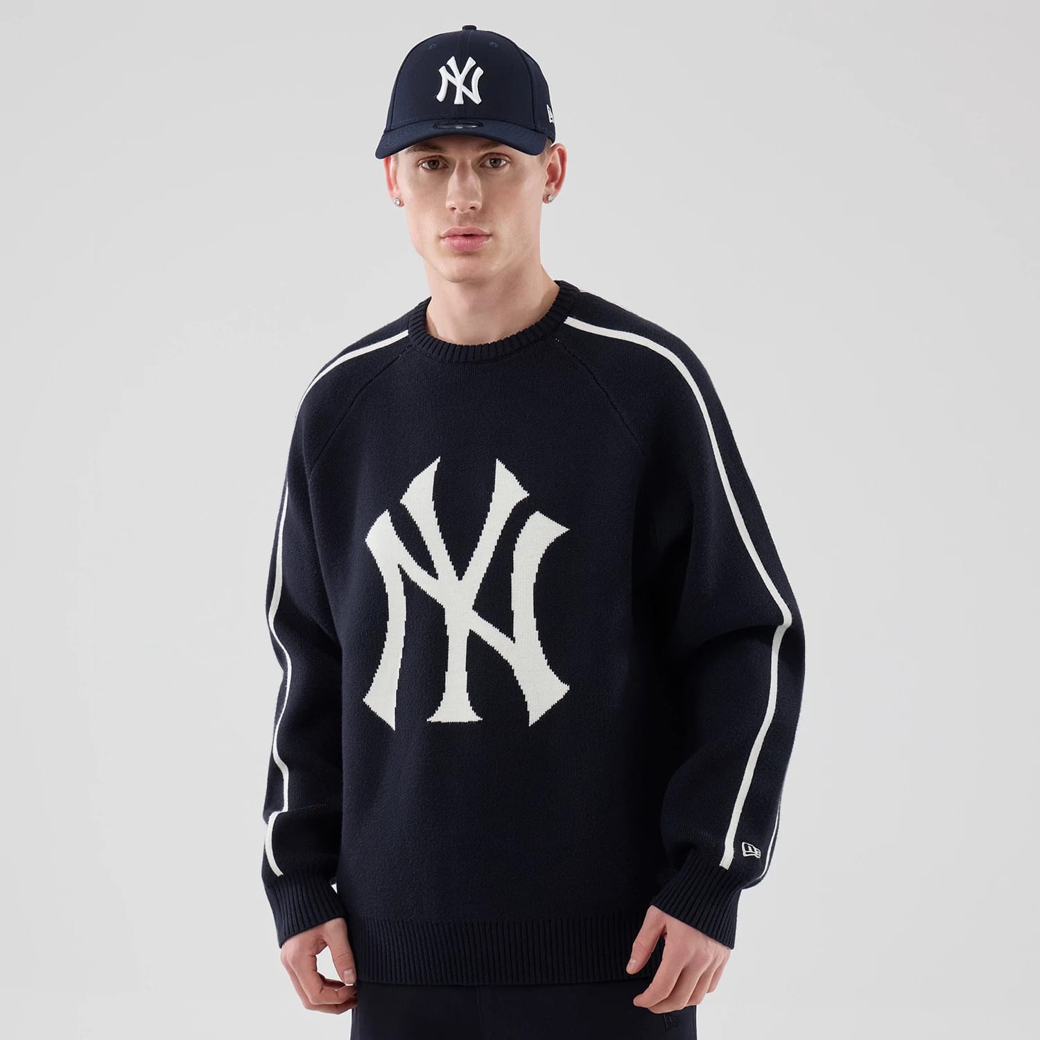 The model is wearing this MLB Knit New York Yankees Knitted Sweater in navy. 1