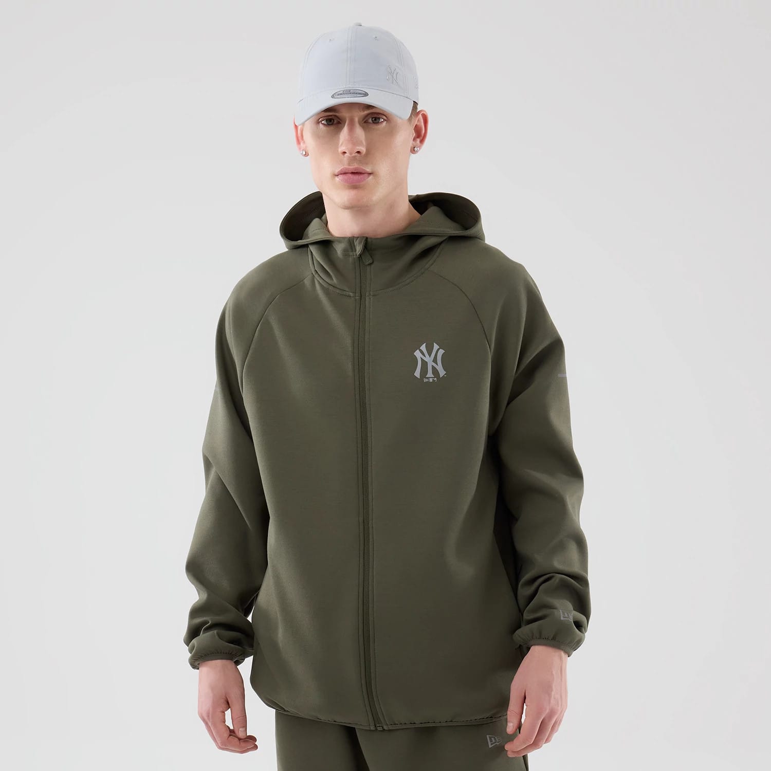 The model is wearing this MLB Core Plus New York Yankees Full Zip Hoodie in green. 1