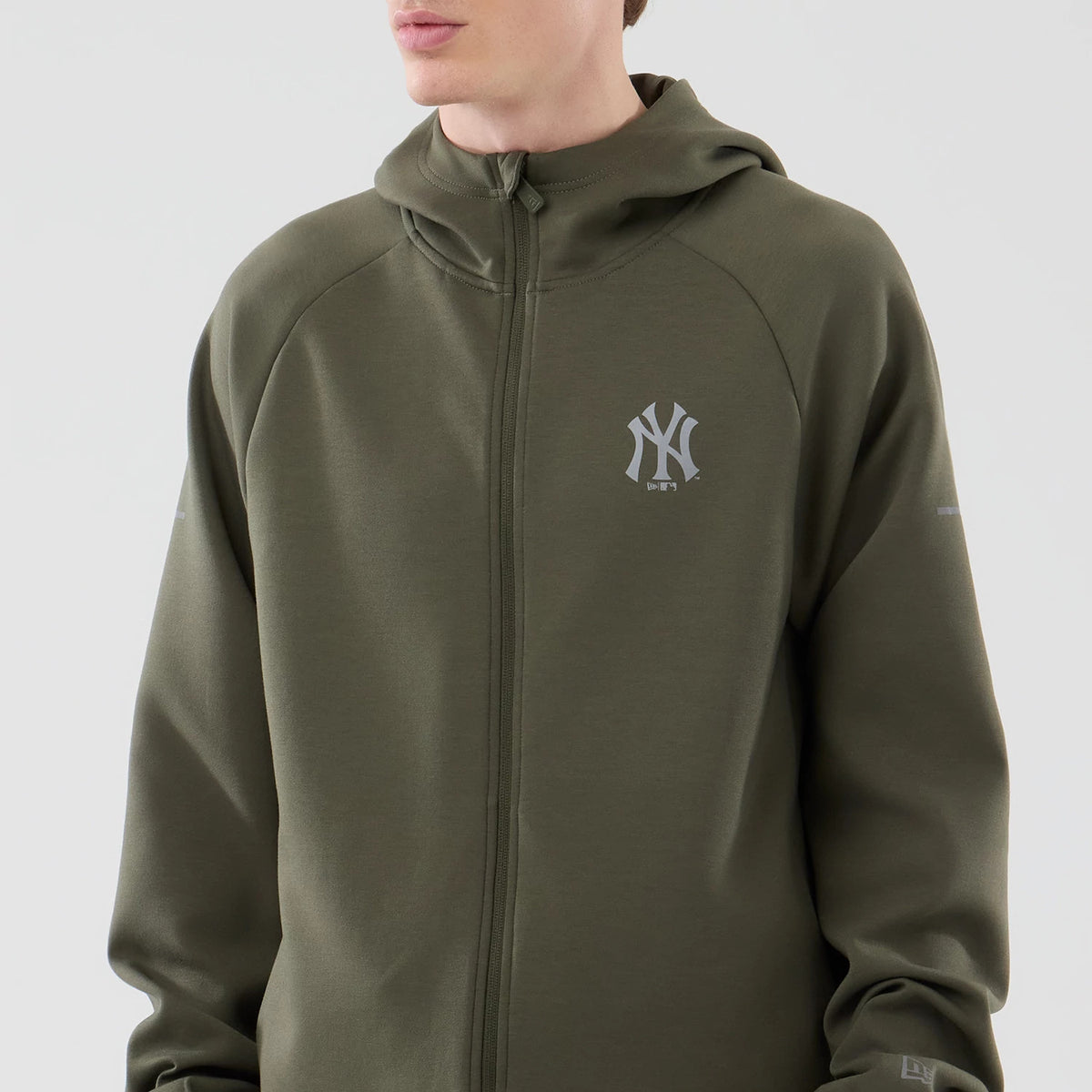 The model is wearing this MLB Core Plus New York Yankees Full Zip Hoodie in green. 3