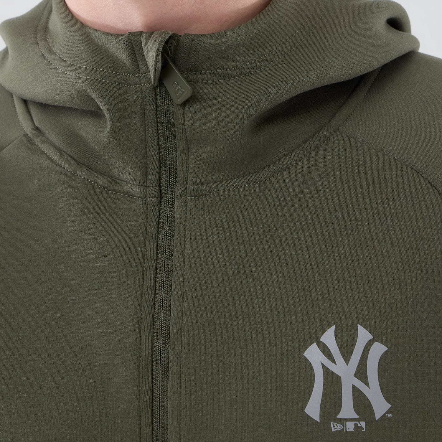 The model is wearing this MLB Core Plus New York Yankees Full Zip Hoodie in green. 4