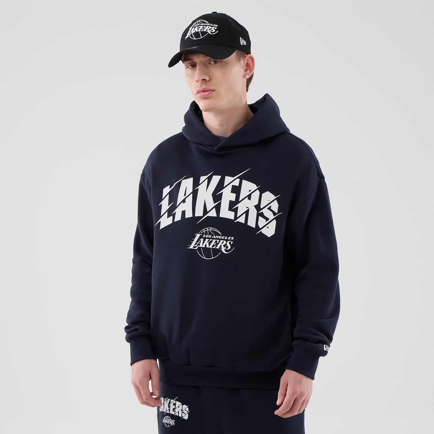 The model is wearing this NBA Core Plus LA Lakers Pullover Hoodie in navy. 1
