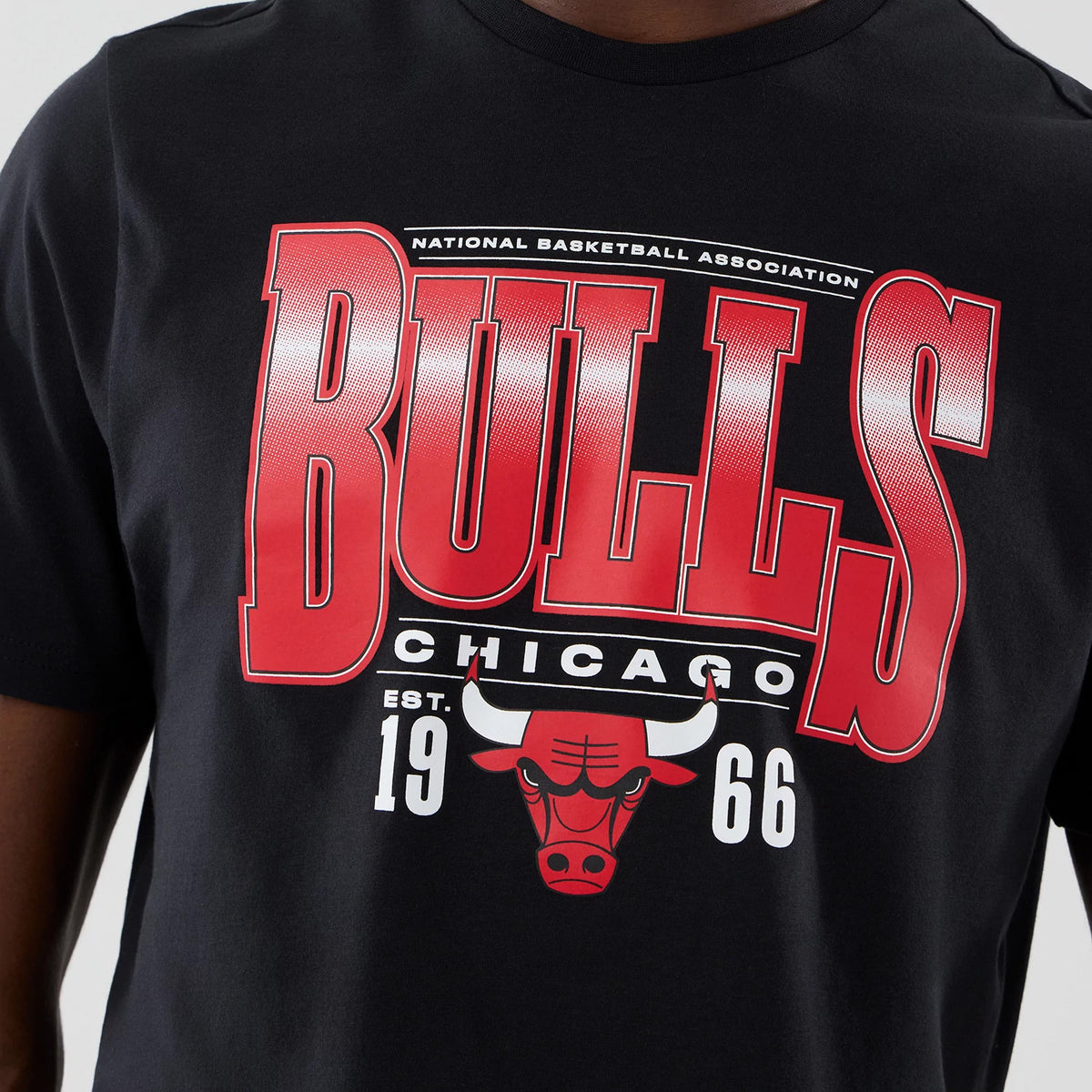 New Era Chicago Bulls NBA Arch Graphic Black T-Shirt, front view displaying the red BULLS printed lettering on the chest, with smaller CHICAGO text beneath, and a prominent red Bulls logo centred below.