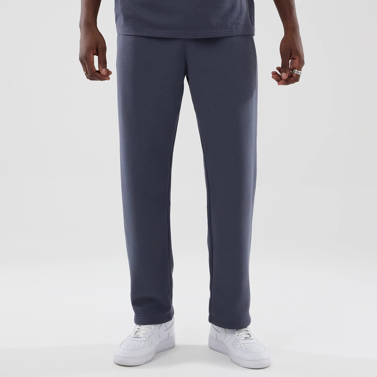 The model is wearing these New Era Tech Straight Leg Joggers in grey. 1