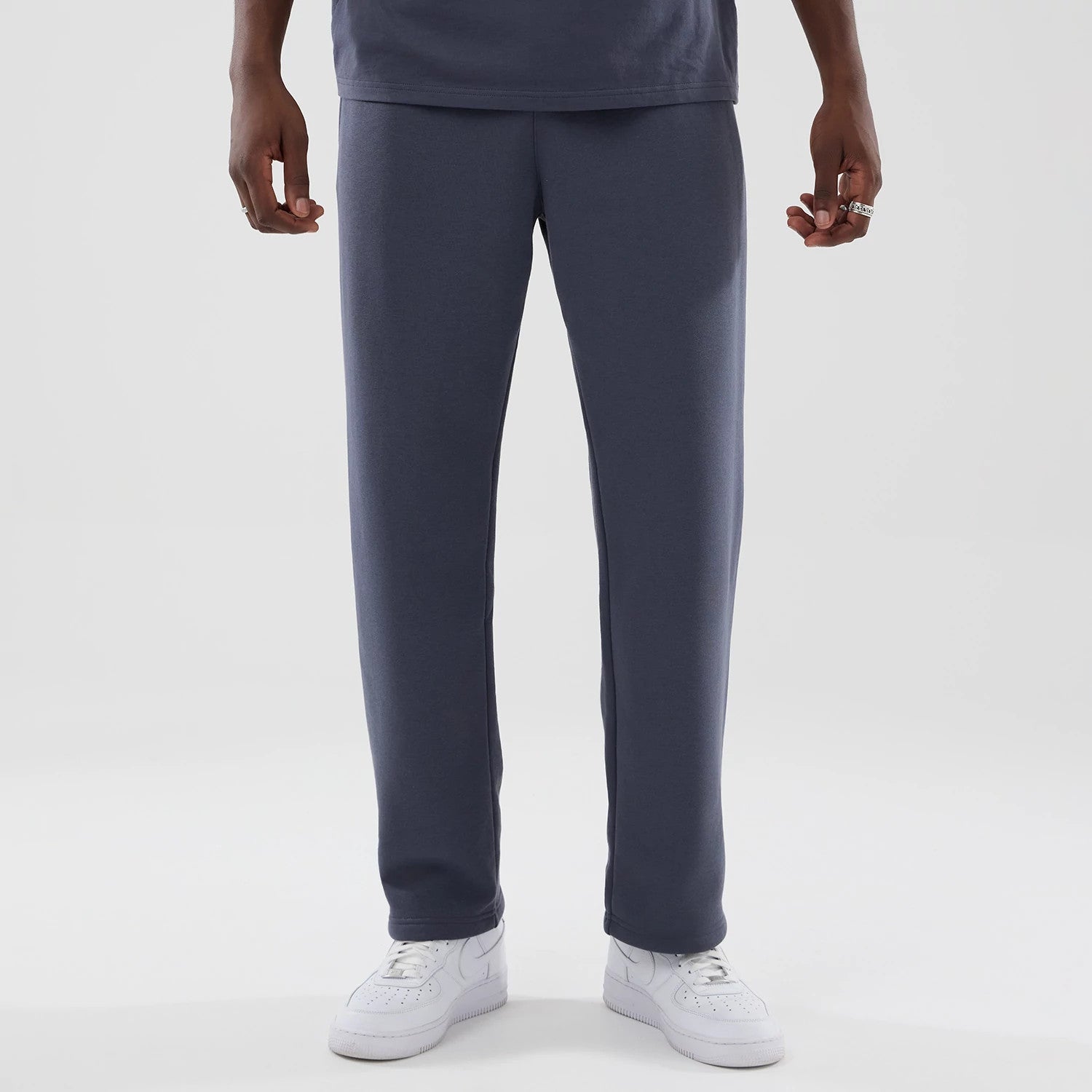 The model is wearing these New Era Tech Straight Leg Joggers in grey. 1