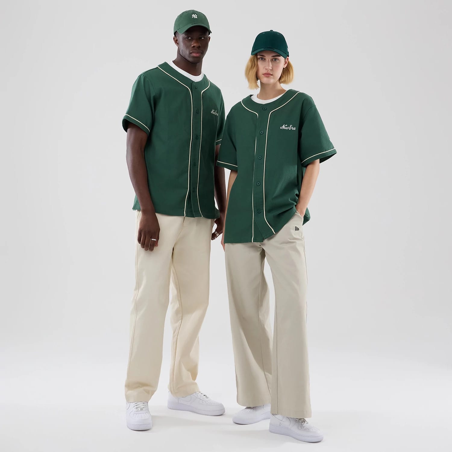 The model is wearing this New Era Baseball Jersey in dark green. 1