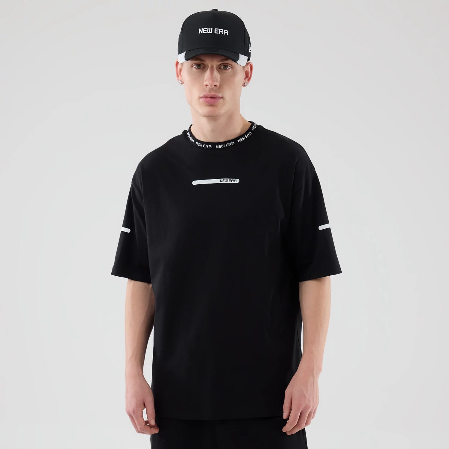 The model is wearing this New Era Tech T-Shirt in black. 1