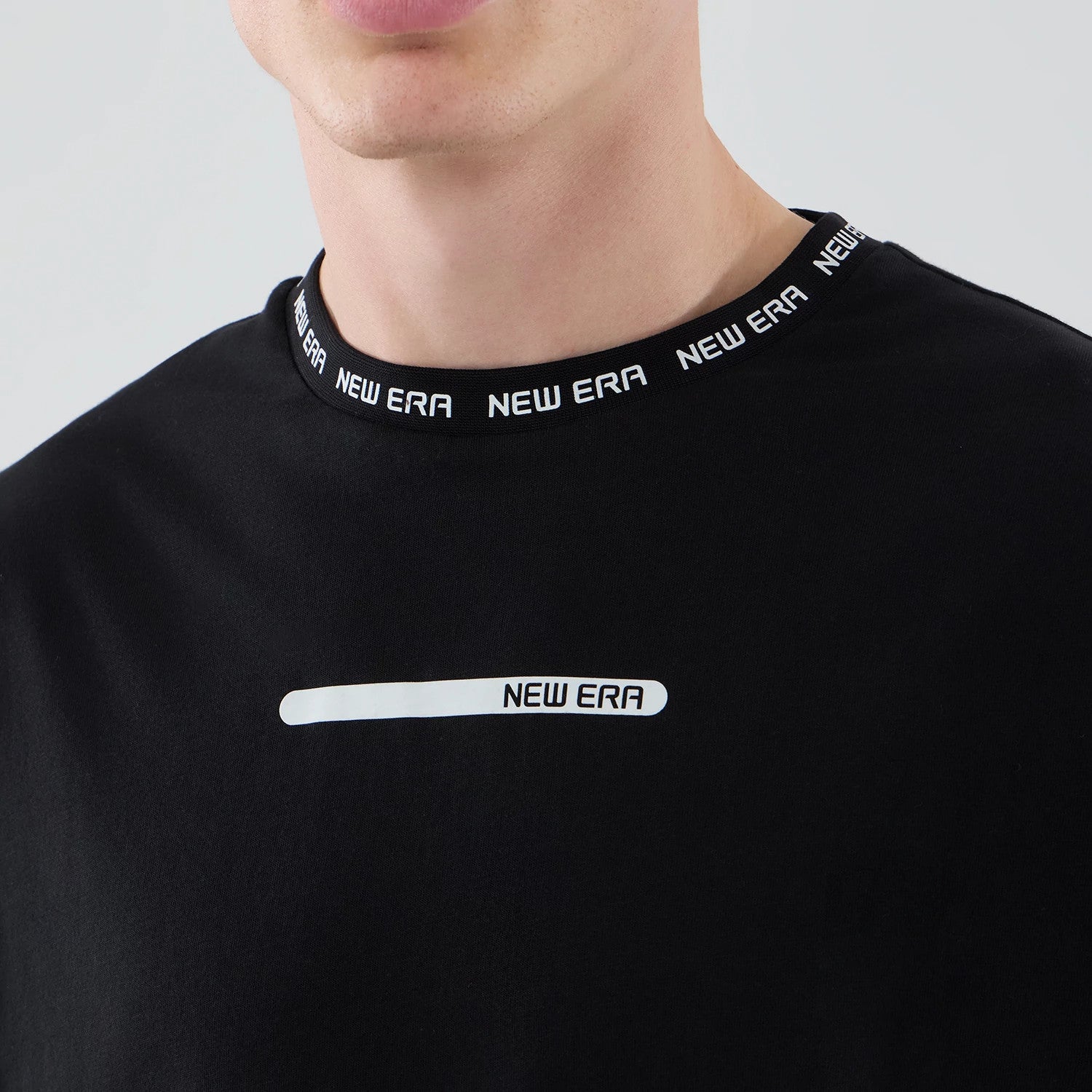 The model is wearing this New Era Tech T-Shirt in black. 4