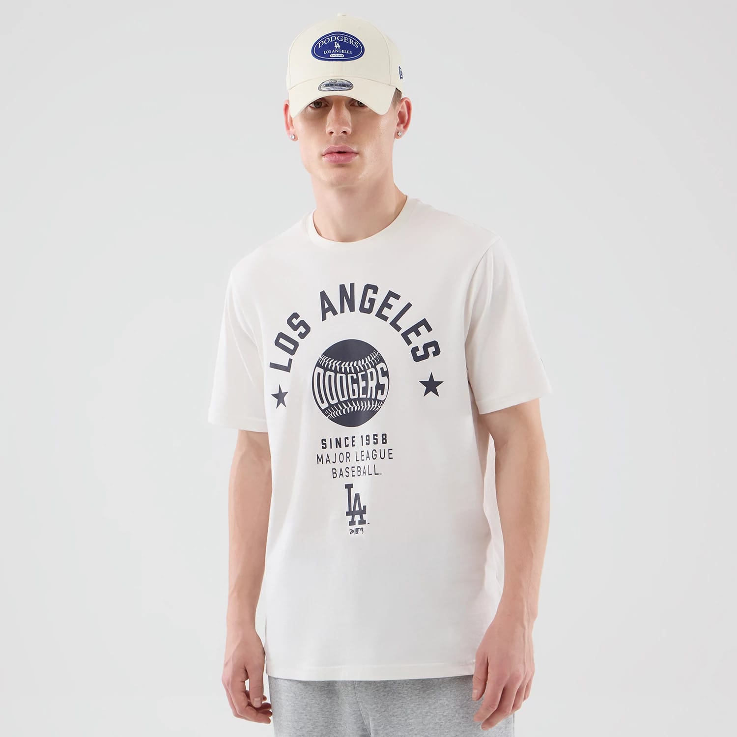The model is wearing this MLB Graphic LA Dodgers T-Shirt in open white. 1