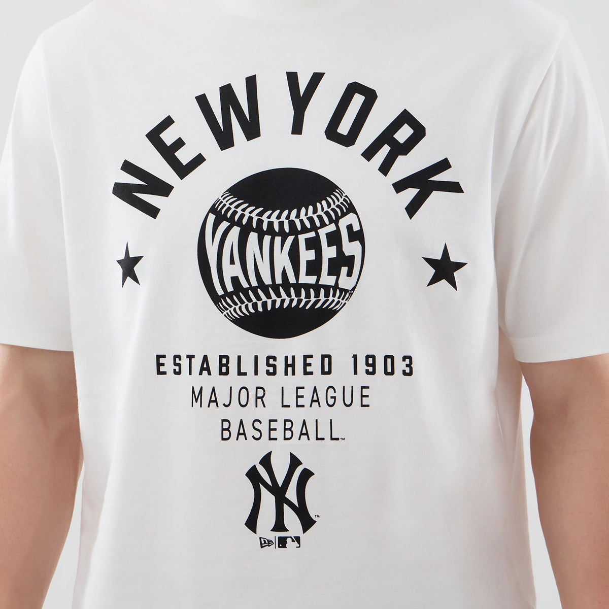 New Era New York Yankees MLB Graphic White T-Shirt, front view showing black New York Yankees lettering above a large baseball graphic in the centre, with Established 1903 and Major League Baseball printed beneath, and the NY logo at the bottom.