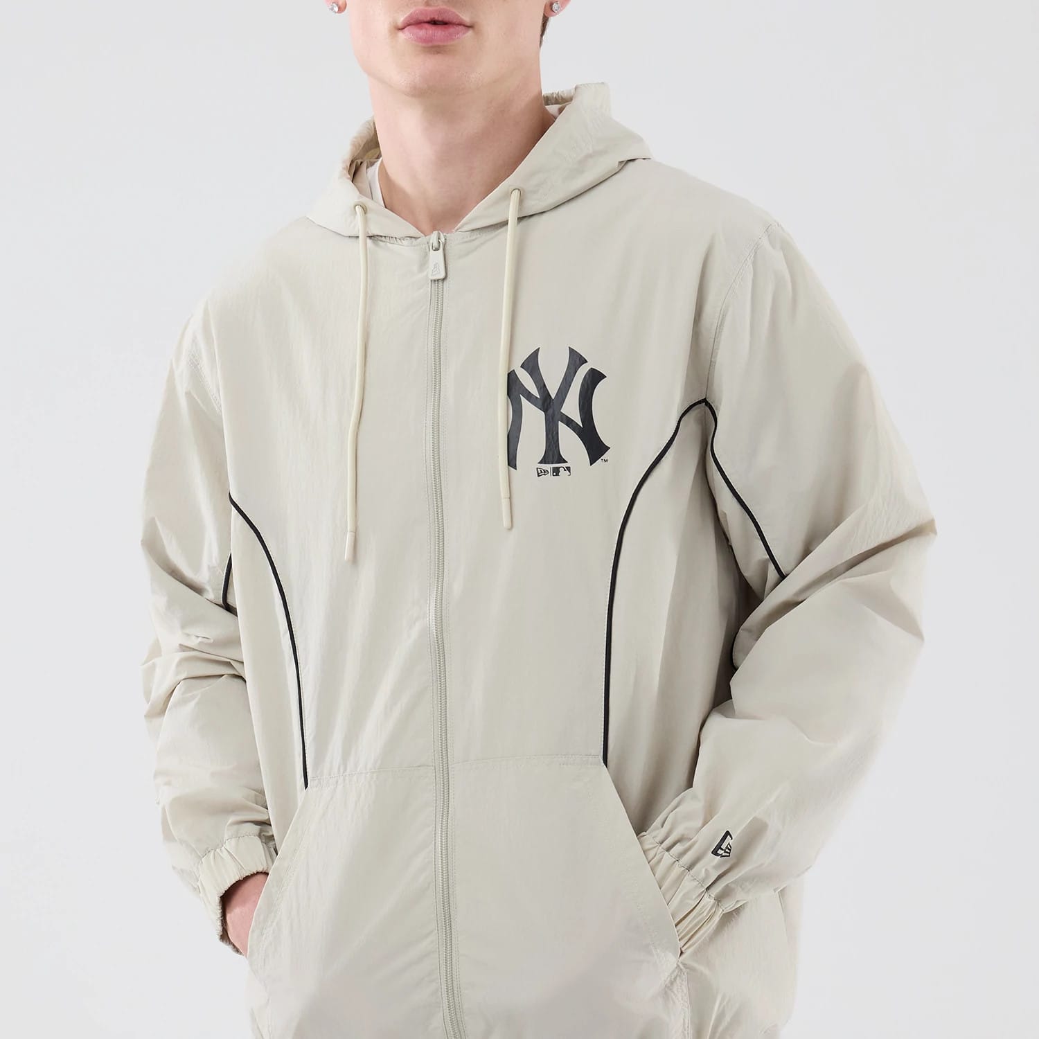 The model is wearing this MLB Piping New York Yankees Jacket in cream. 3