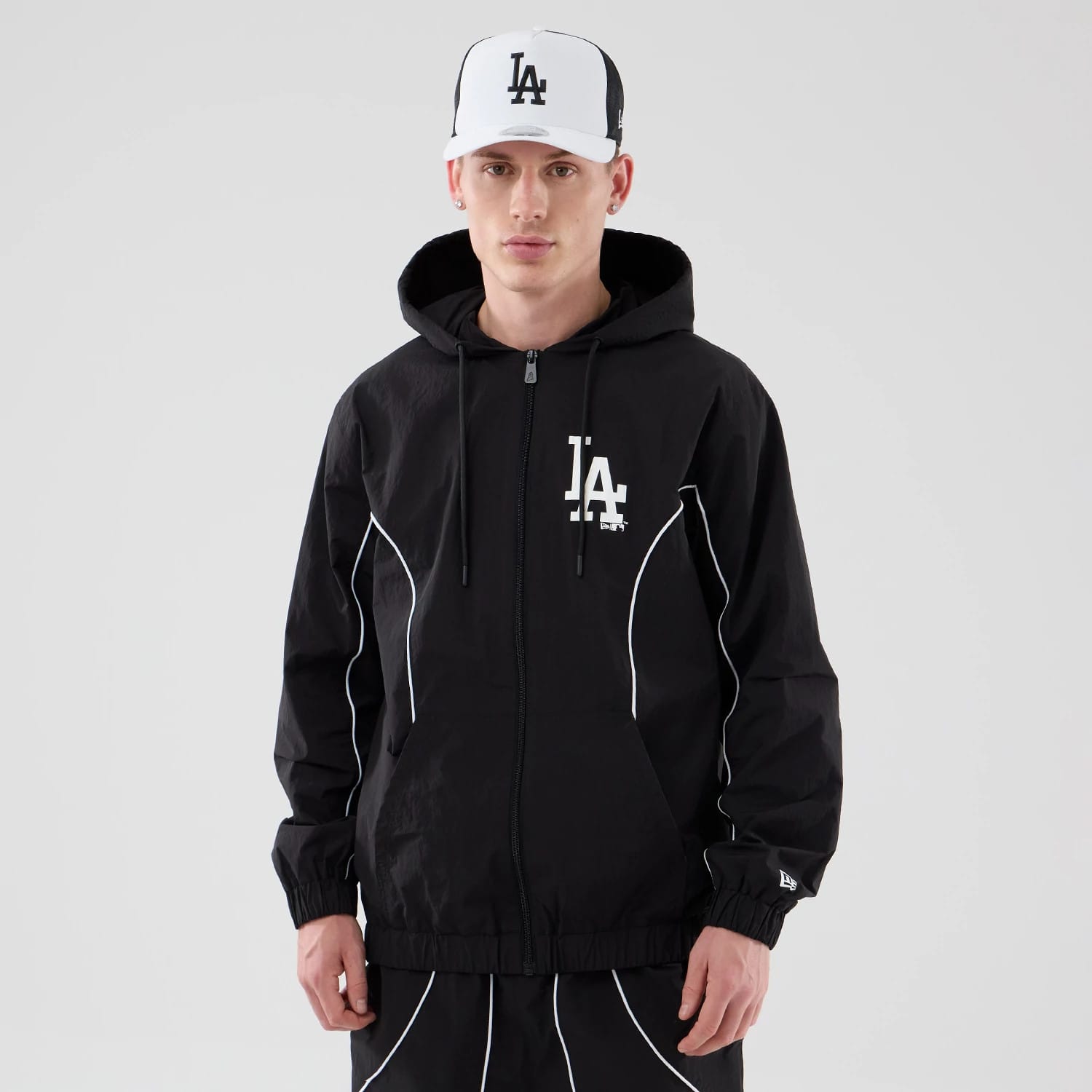 The model is wearing this MLB Piping LA Dodgers Jacket in black. 1