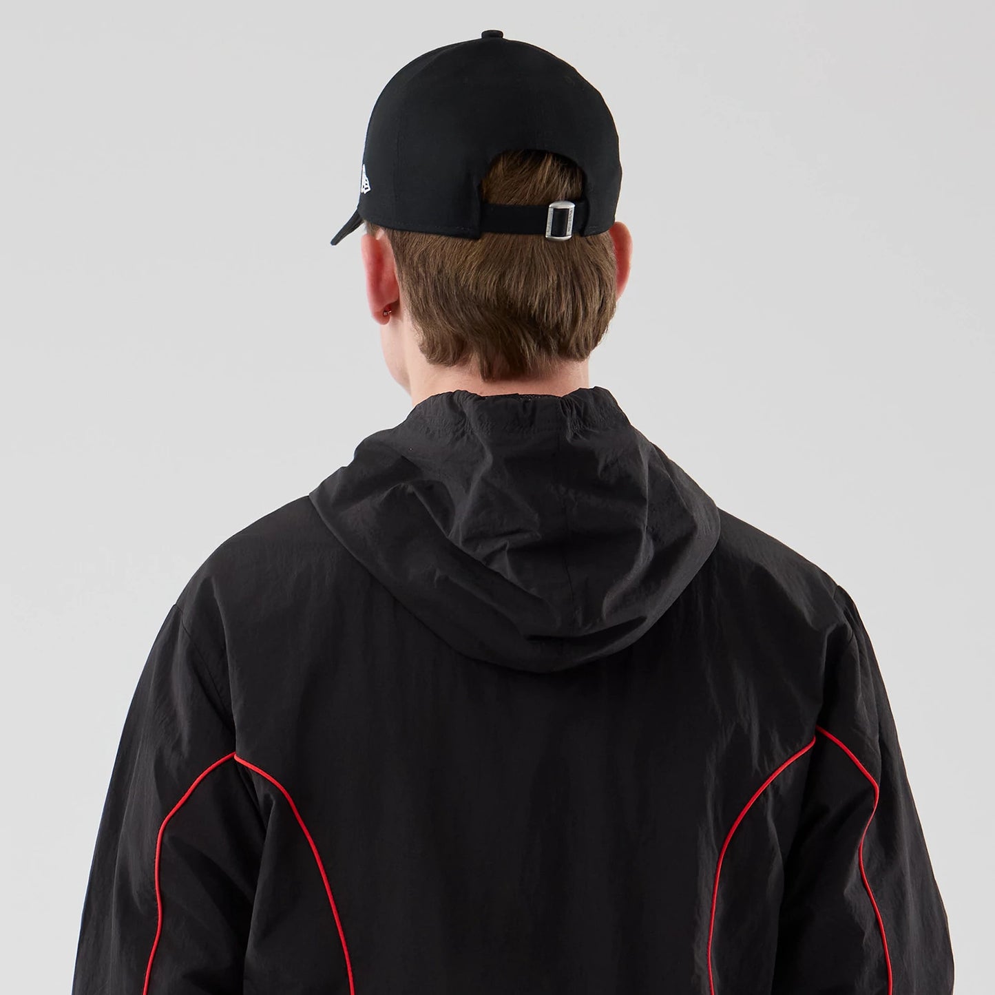The model is wearing this Red Bull Racing Piping Track Jacket in black. 7
