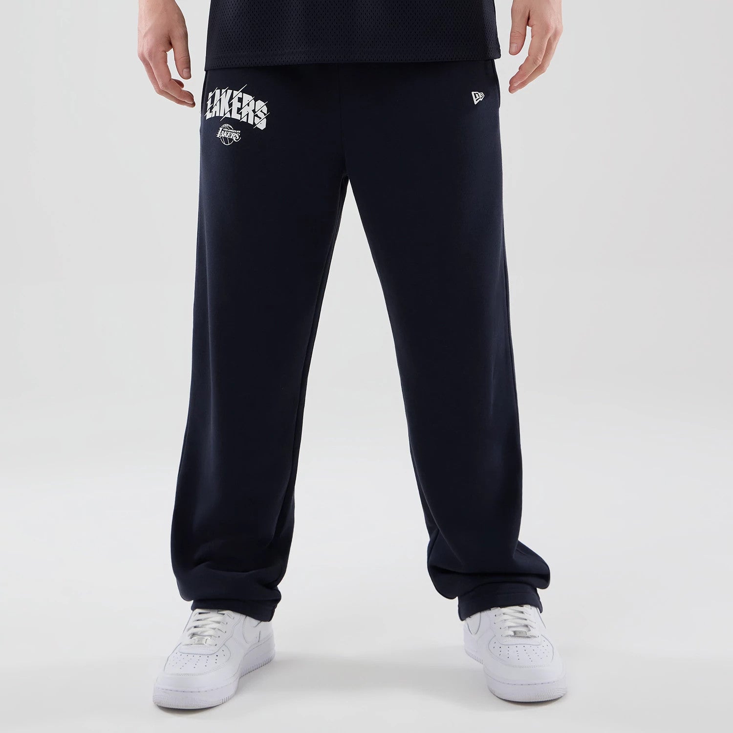 The model is wearing these NBA Core Plus LA Lakers Straight Leg Joggers in navy. 1