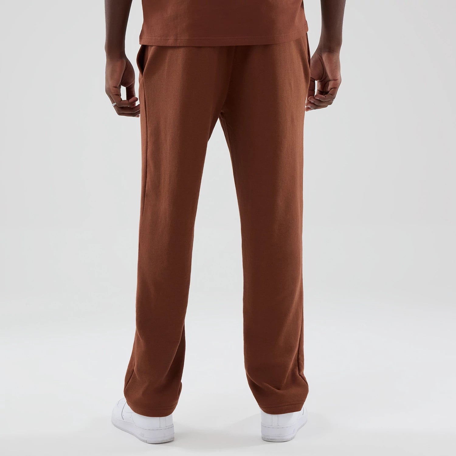 The model is wearing these NBA Core Plus Chicago Bulls Straight Leg Joggers in brown. 2