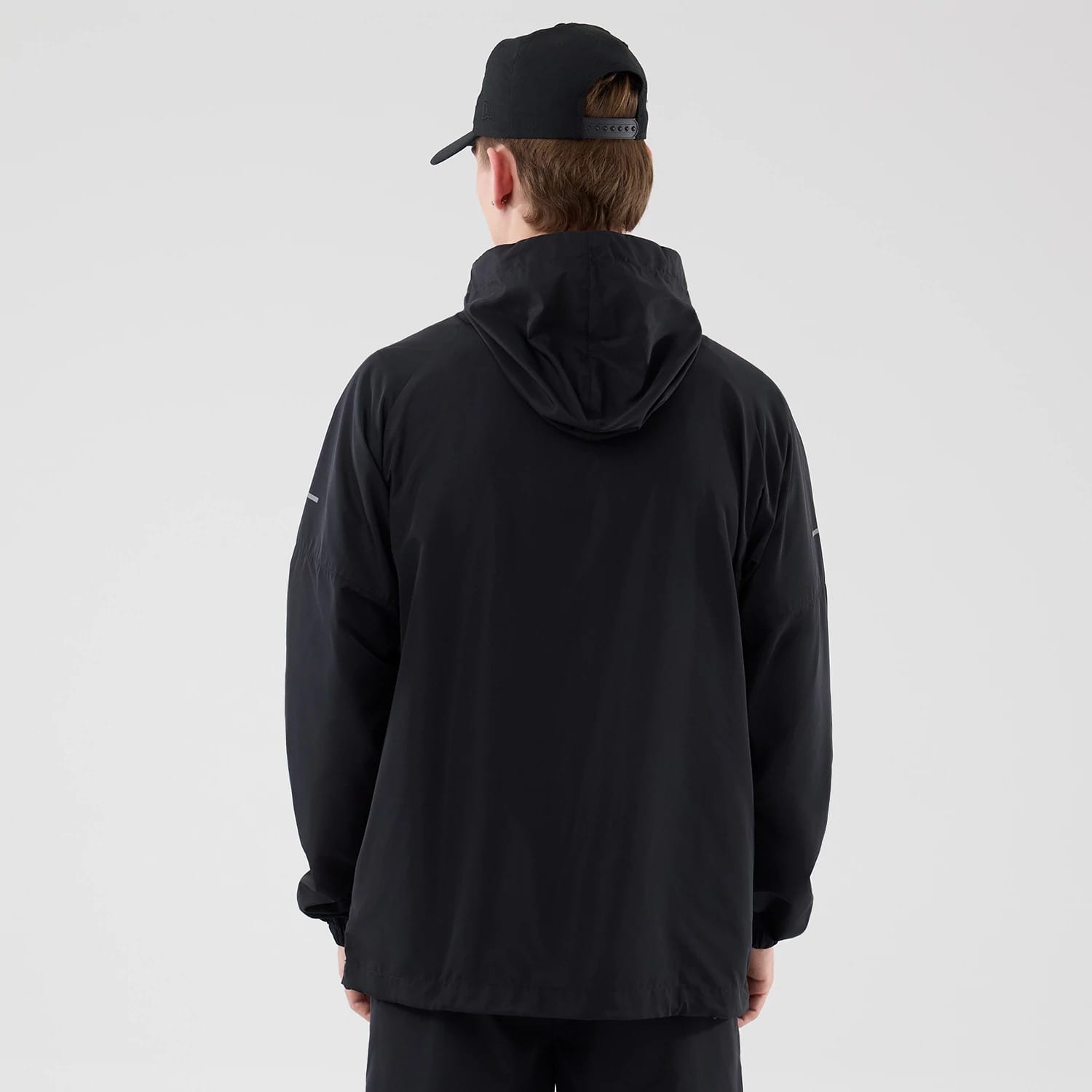 The model is wearing this MLB Core Plus Windbreaker New York Yankees Jacket in black. 2