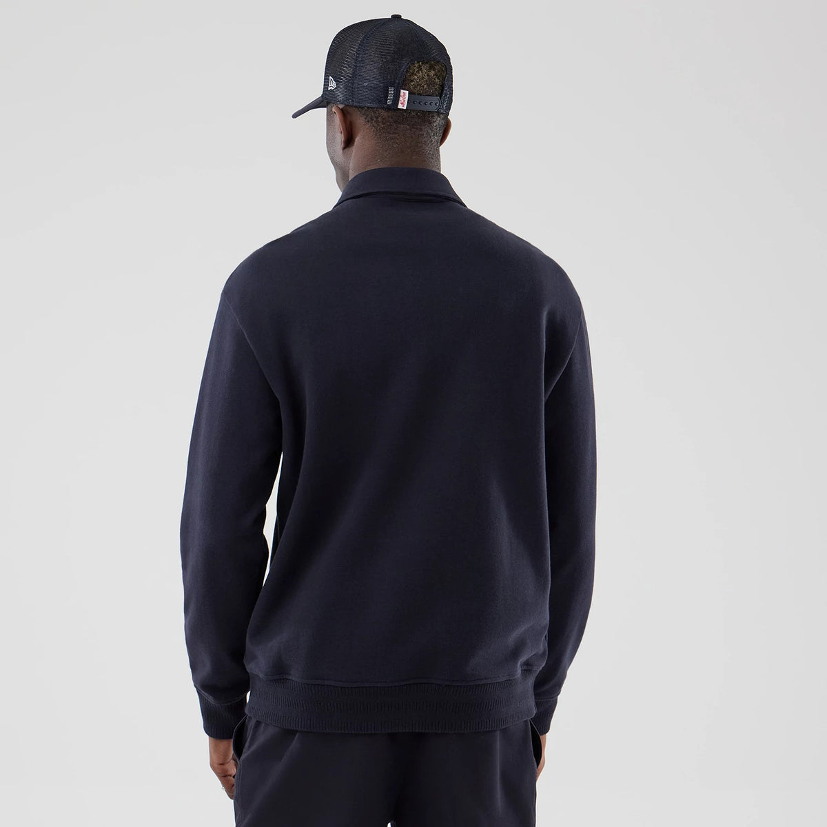 The model is wearing this MLB LA Dodgers Oversized 1/4 Zip Sweater in navy. 2