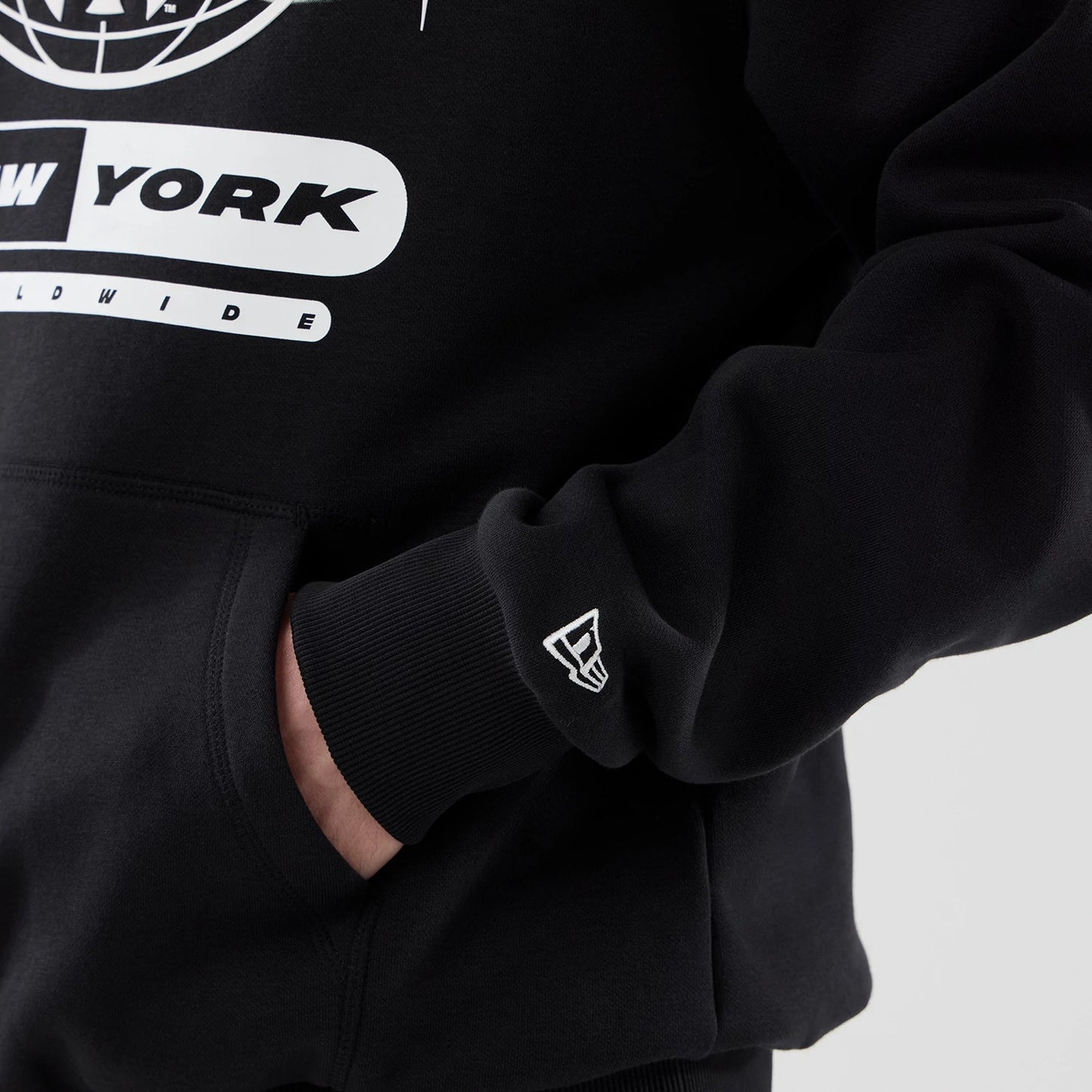 The model is wearing this MLB Logo Graphic New York Yankees Oversized Pullover Hoodie in black. 7