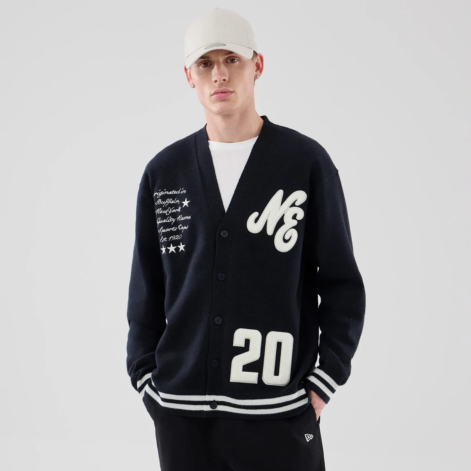 The model is wearing this New Era Heritage Cardigan in navy. 3