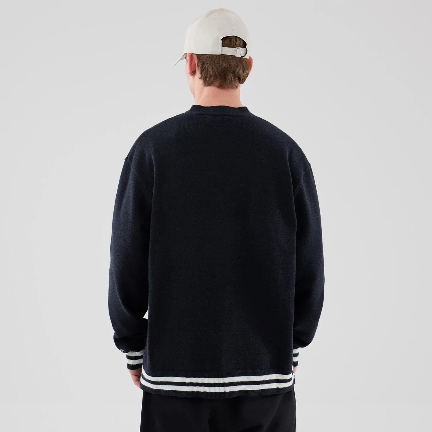 The model is wearing this New Era Heritage Cardigan in navy. 2
