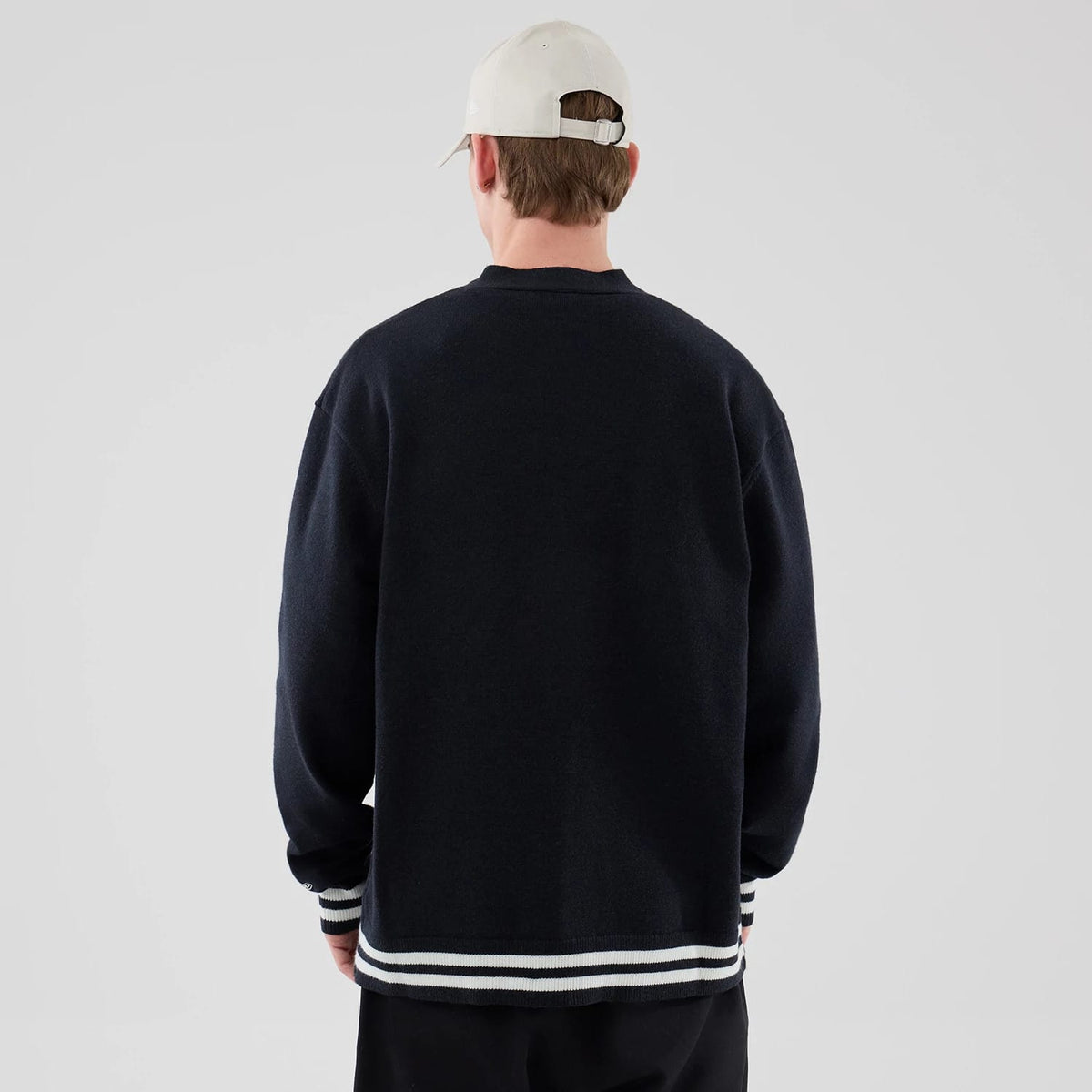 The model is wearing this New Era Heritage Cardigan in navy. 2
