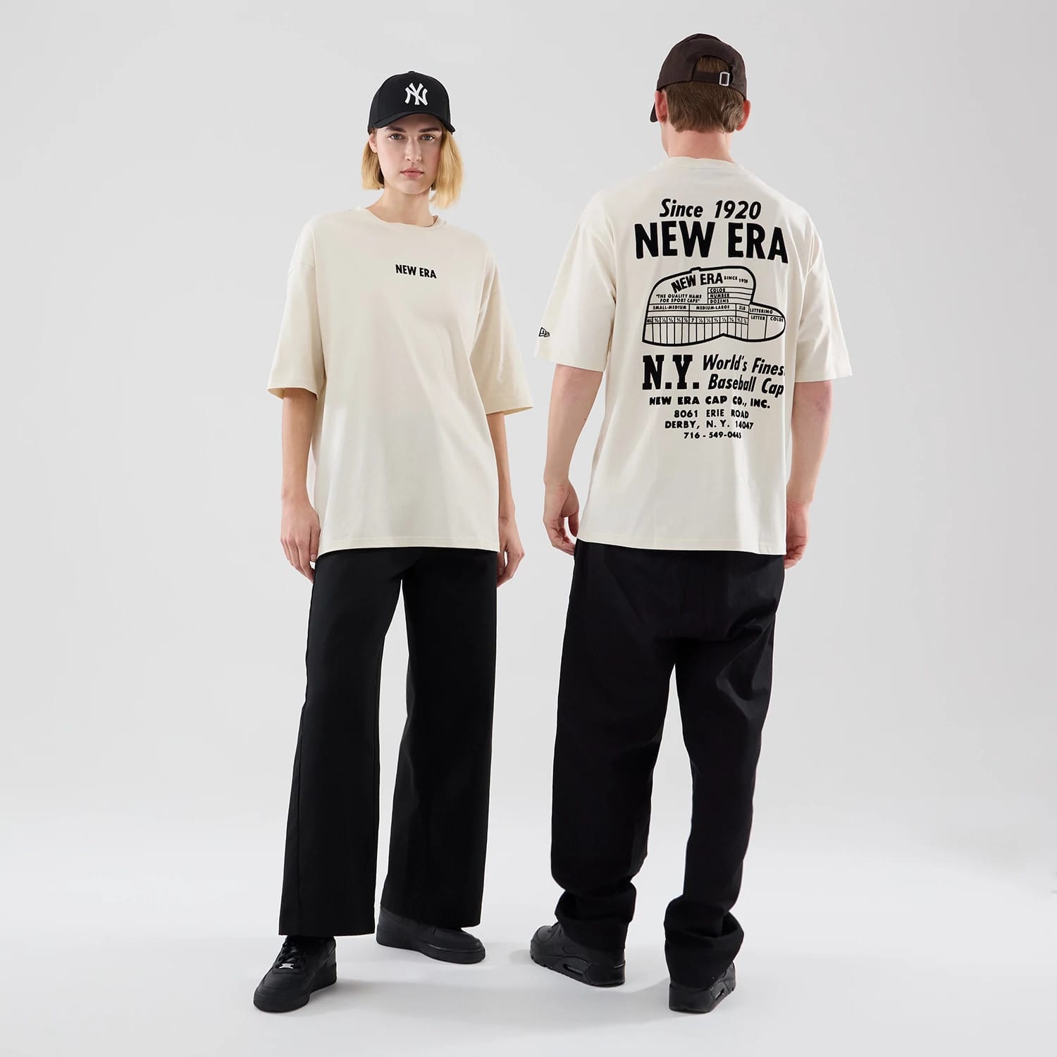 The model is wearing this New Era Cap Graphic Oversized T-Shirt in cream. 1