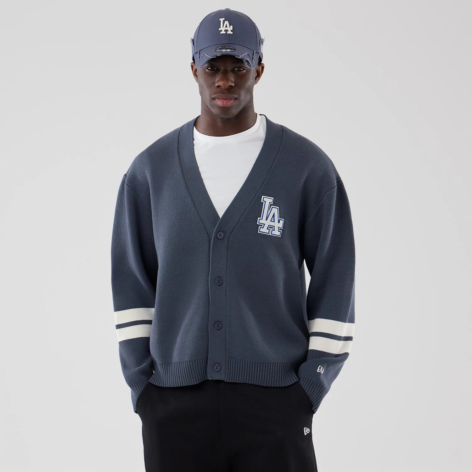 The model is wearing this MLB Knit LA Dodgers Cardigan in grey. 1
