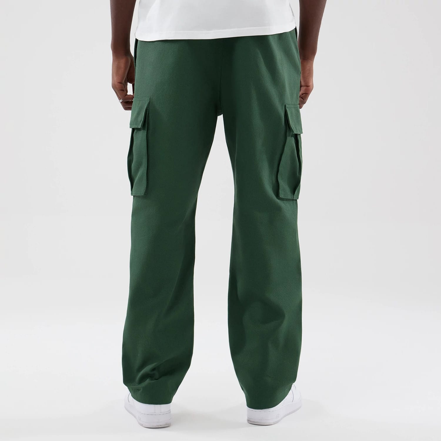 The model is wearing these New Era Cargo Trousers in dark green. 2