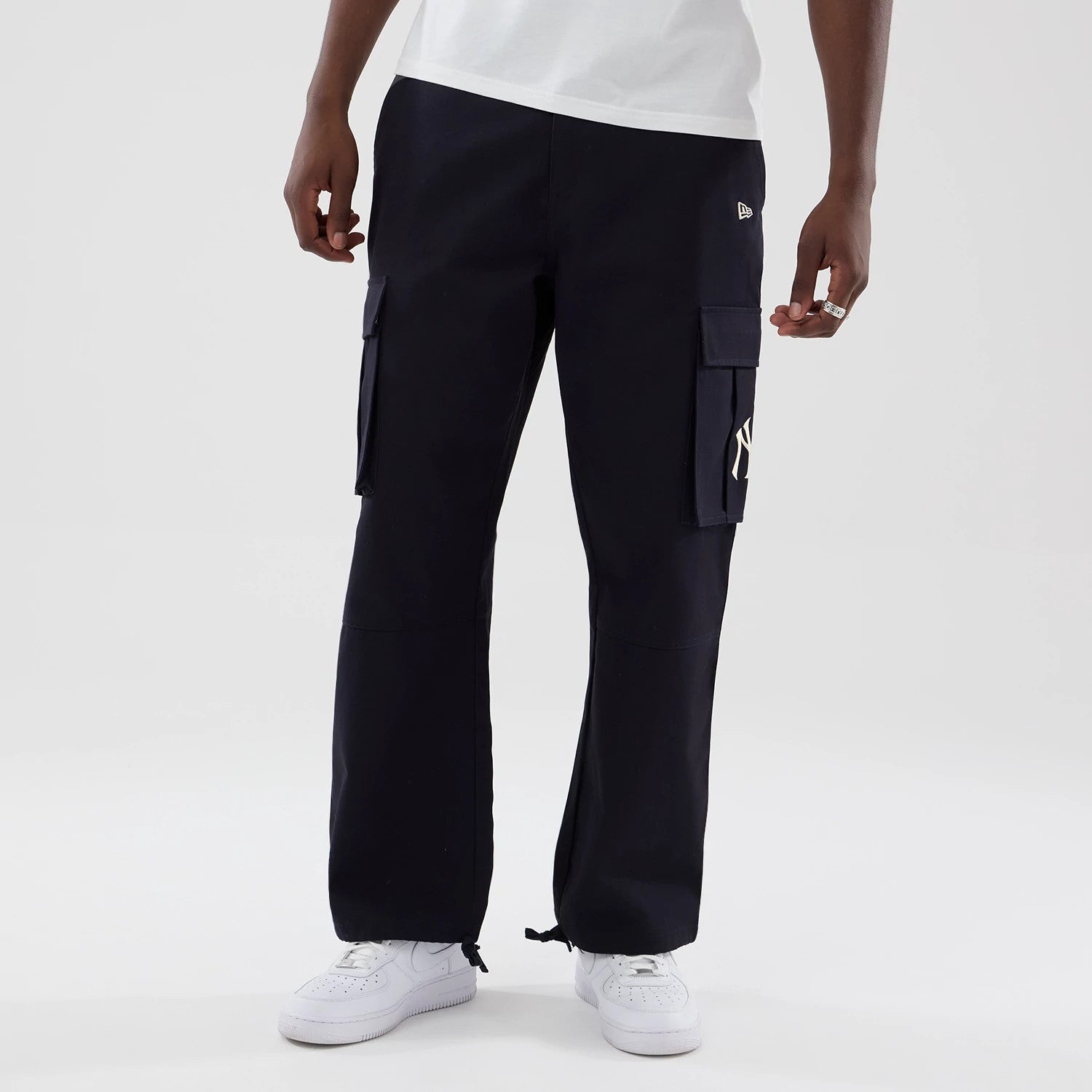 The model is wearing these MLB New York Yankees Cargo Trousers in navy. 3