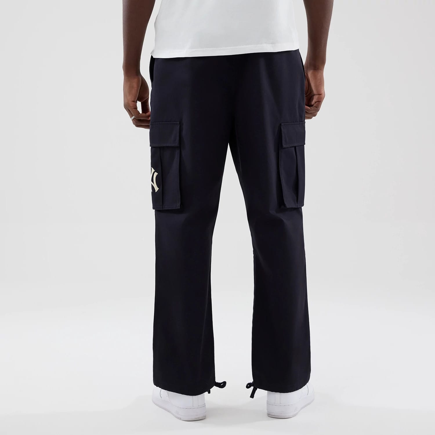 The model is wearing these MLB New York Yankees Cargo Trousers in navy. 2