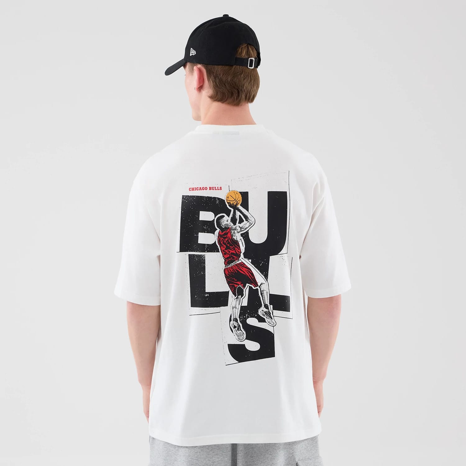 The model is wearing this NBA Player Graphic Chicago Bulls Oversized T-Shirt in white. 2