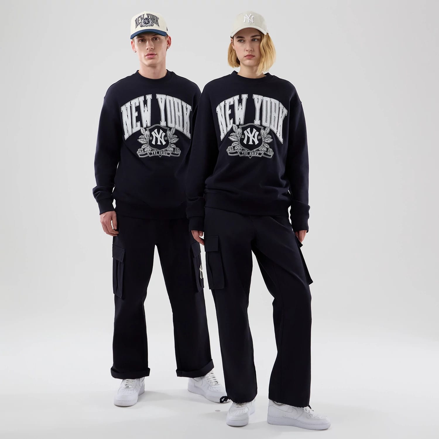 The model is wearing this MLB Arch Graphic New York Yankees Oversized Crew Neck Sweater in navy. 1
